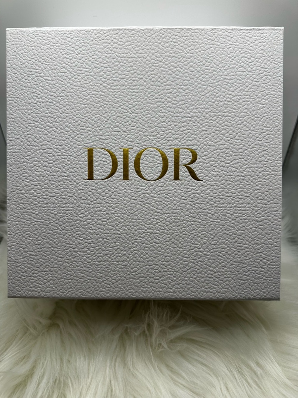 Dior White Gift Box with Gold Logo and protective wrapping inside